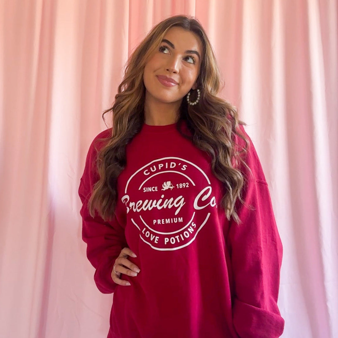 Cozy Red Sweatshirt Women Oversized Valentine Day Outfit Soft Fabric Pullover Relaxed Fit Style Cupids Brewing Co Love Potions Logo Design Comfortable Casual Wear Perfect Holiday Gift Winter Comfort Clothing Bold Red Color Premium