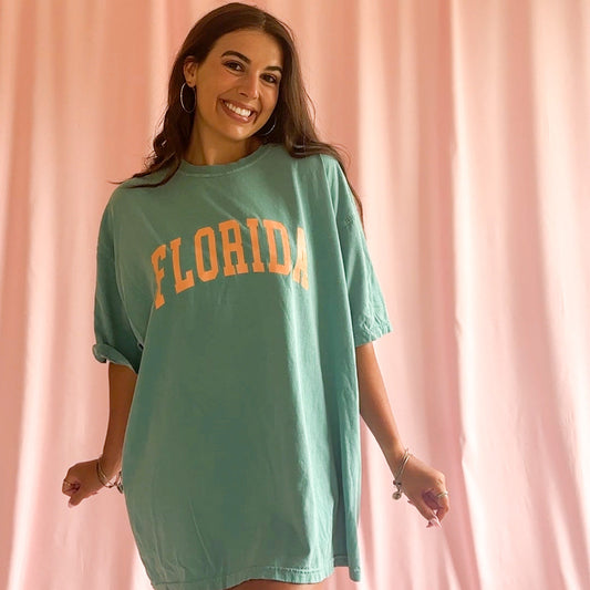 Florida T Shirt Vintage Collegiate Design Seafoam Green Color Comfort Colors Style Soft Cotton Unisex Fit Orange Lettering Perfect State Pride Apparel Retro Worn In Feel Casual Beach Day Outfit Game Day Style Relaxed Coastal Vibes Premium