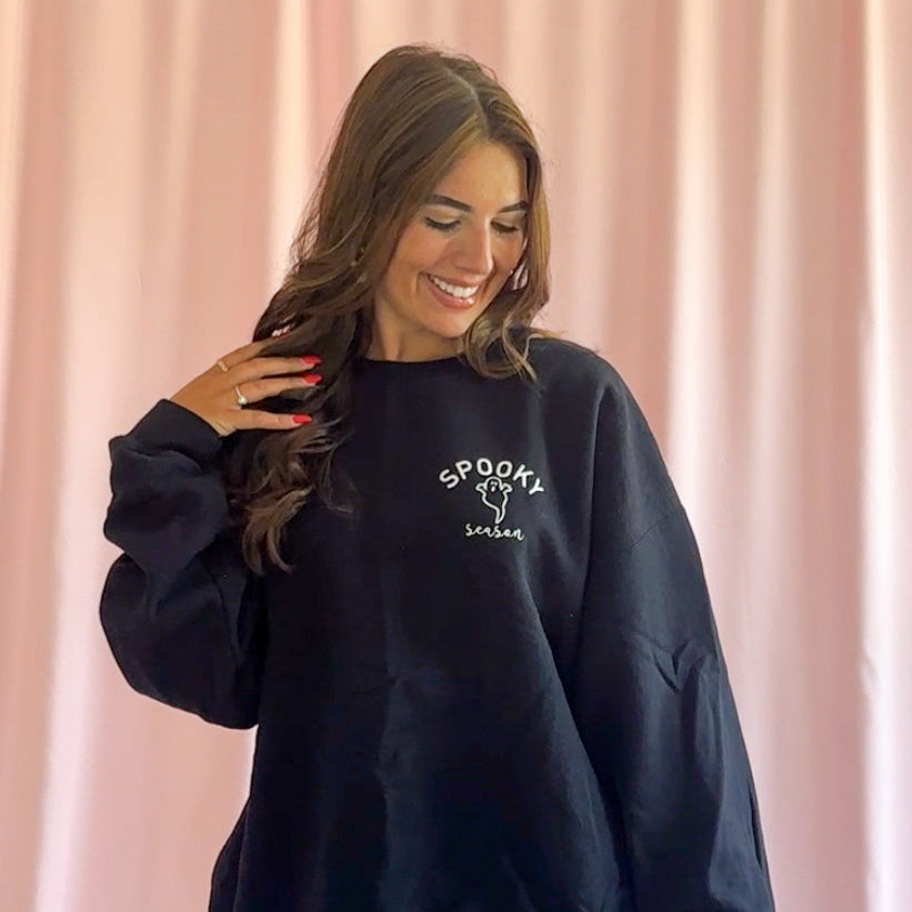 Halloween Party Sweatshirt Ghost Design Black Cozy Comfortable Outfit Perfect Trick Or Treat Essential Spooky Season Fashion Soft Fabric Casual Wear Hauntingly Adorable Graphic Print Oversized Relaxed Fit Option Warm Autumn Celebration