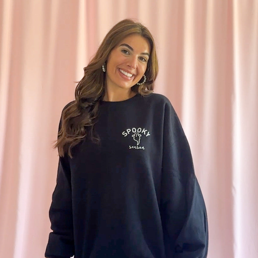 Cozy Black Sweatshirt Halloween Ghost Design Soft Comfortable Fabric Perfect Spooky Season Wear Casual Party Outfit Essential Trick Or Treat Fashion Oversized Relaxed Fit Warm Autumn Style Hauntingly Adorable Print Seasonal Celebration