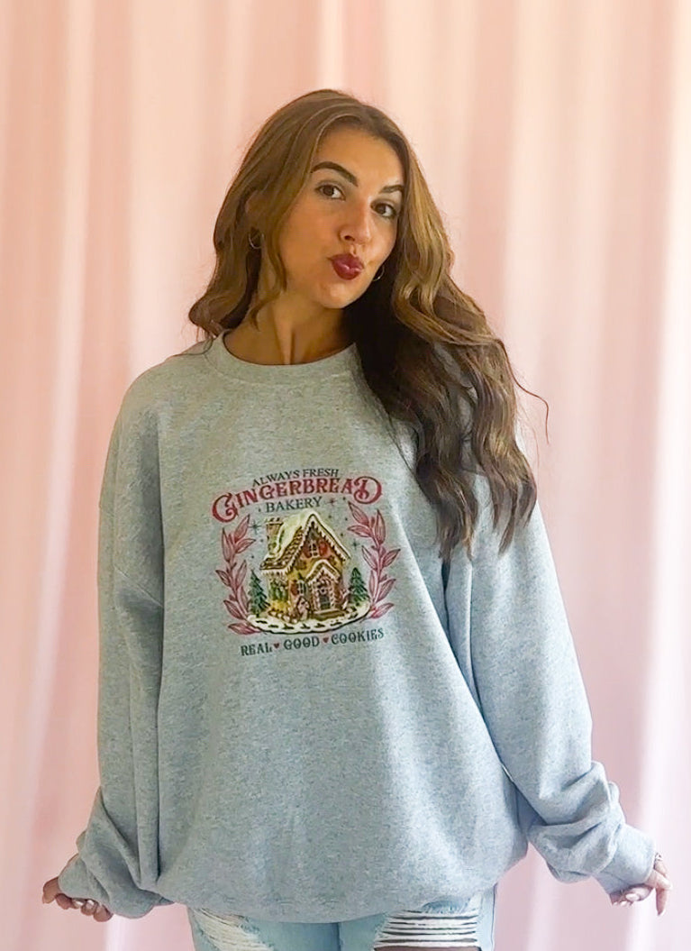 Festive Holiday Sweatshirt Christmas Celebration Pullover Gingerbread House Graphic Cozy Winter Essential Soft Fabric Comfort High Quality Seasonal Wear Perfect Holiday Party Outfit Whimsical Christmas Design Casual Festive Clothing Durable